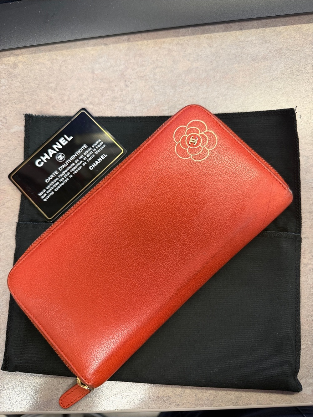 CHANEL Red Leather Camellia Zip Wallet with Gold Accent